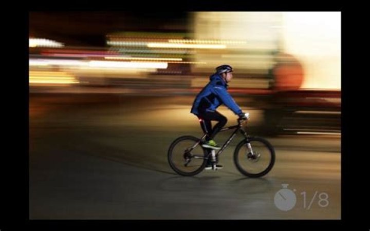 During a panning shot the motion picture camera is?