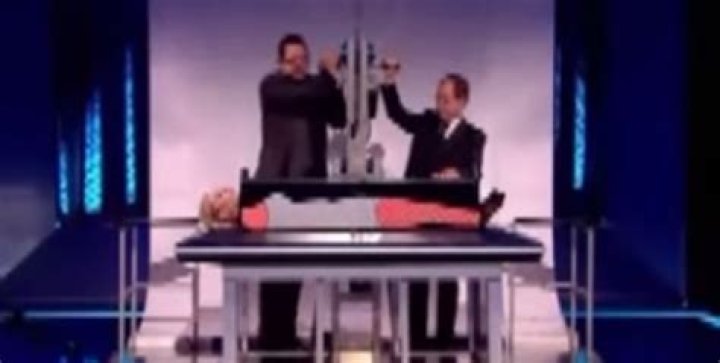 How is the magic trick sawing someone in half?