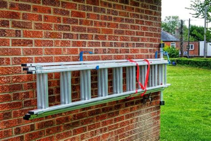 How should short step ladders be stored?